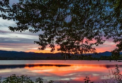 Sunset hitting the beautiful waters of a lake in Glenshore, NC